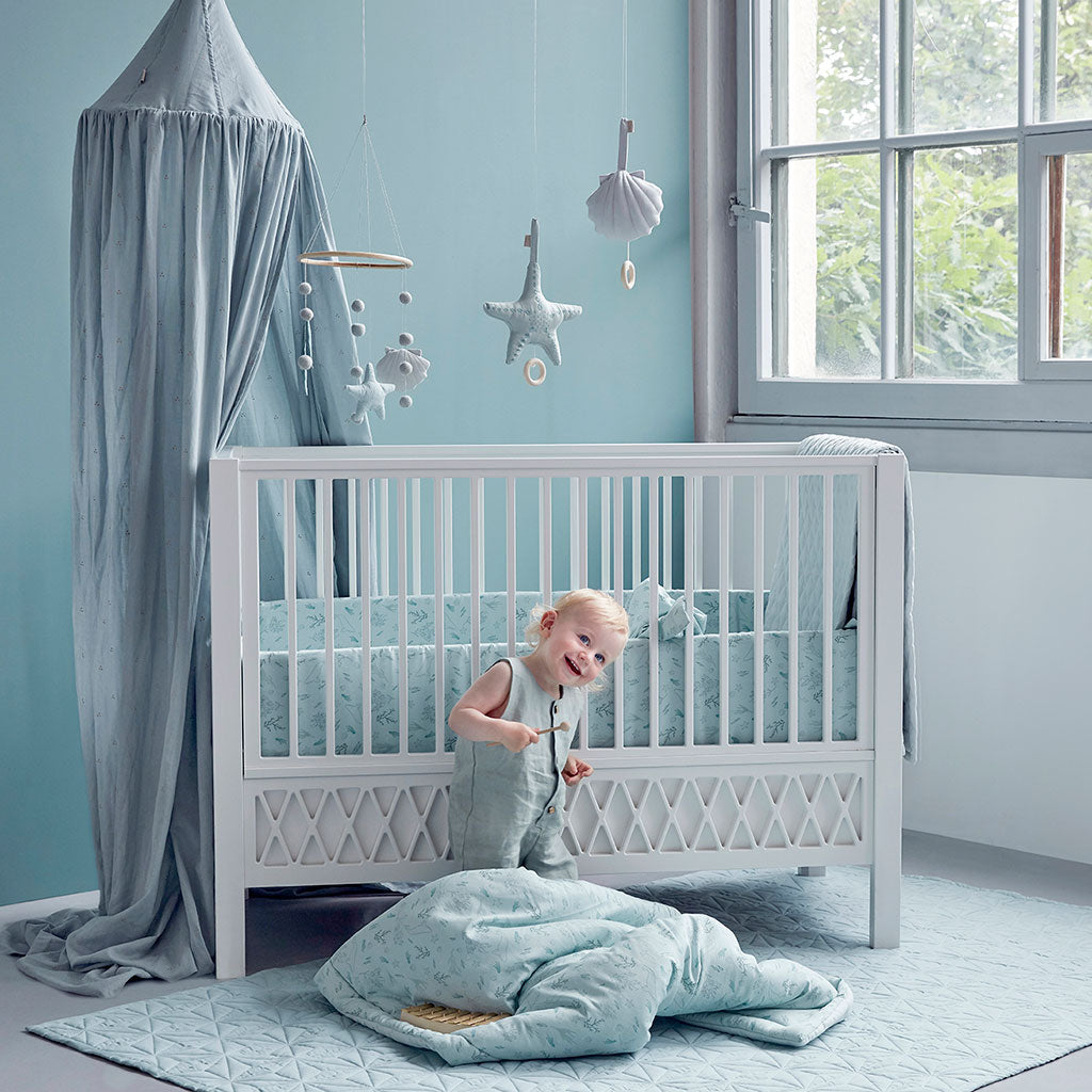 Cam Cam Copenhagen Harlequin Baby Bed White - Lifestyle - The Baby Service