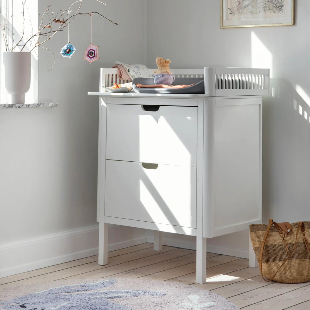 Sebra Classic White changing unit styled in modern nursery setting