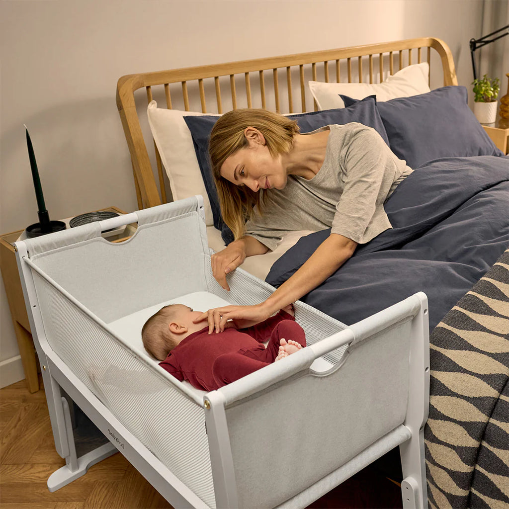 Snuzpod Studio Bedside Crib - Paris White - Lifestyle Mother with Baby - The Baby Service